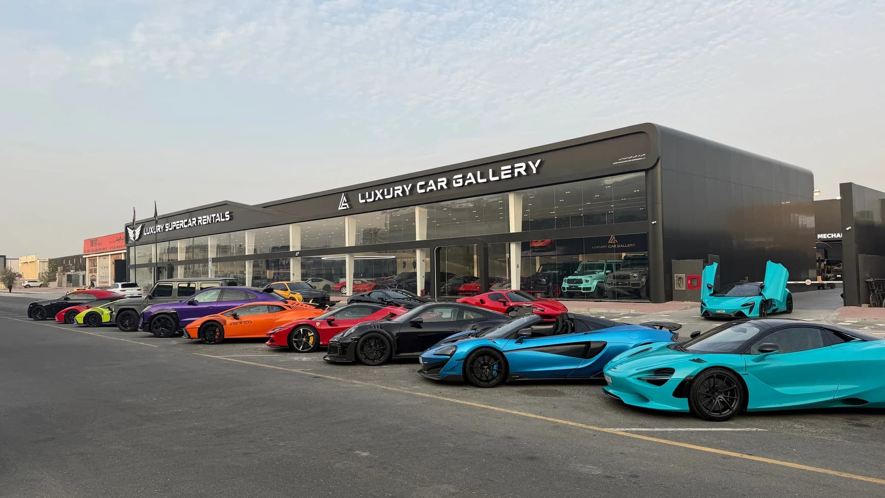 The Luxury Group headquarters with a lineup of supercars in Dubai