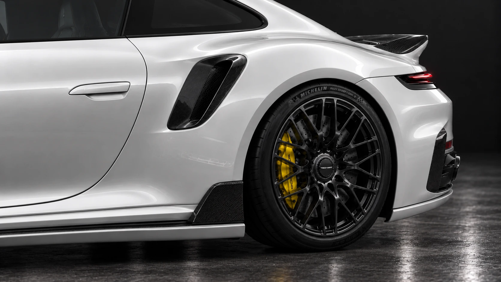 Pearl-white Porsche 911 Turbo S 992.2 with TECHART carbon aero and black Formula IX wheels: Rear wheel & body