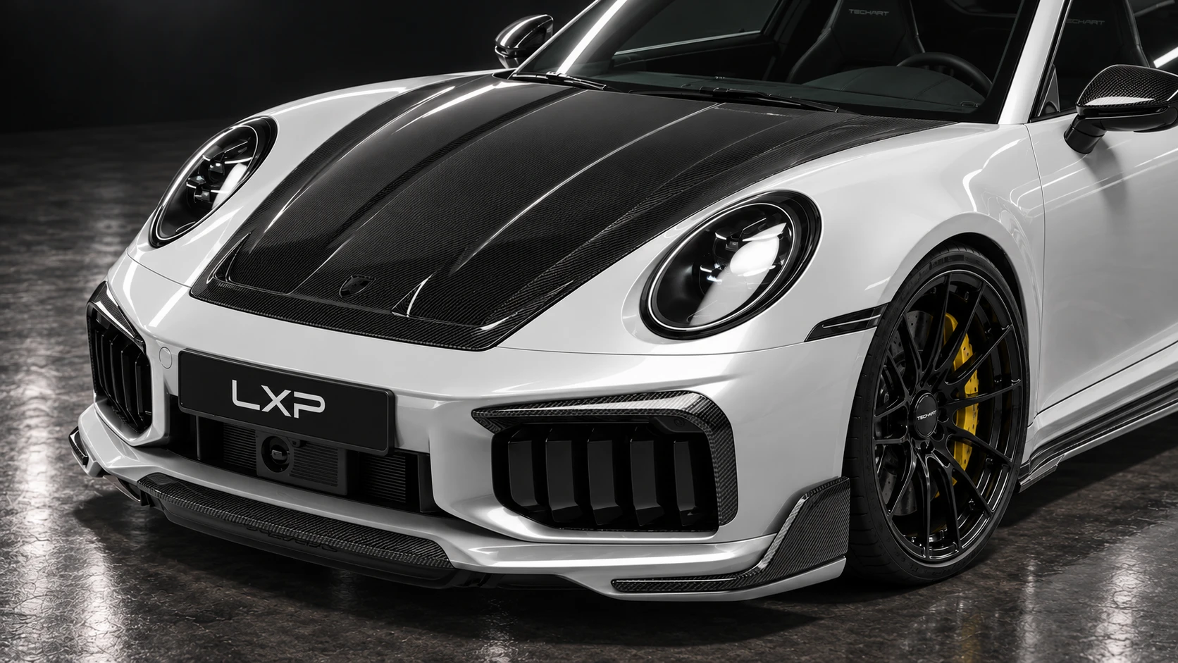 Pearl-white Porsche 911 Turbo S 992.2 with TECHART carbon aero and black Formula IX wheels: Front corner