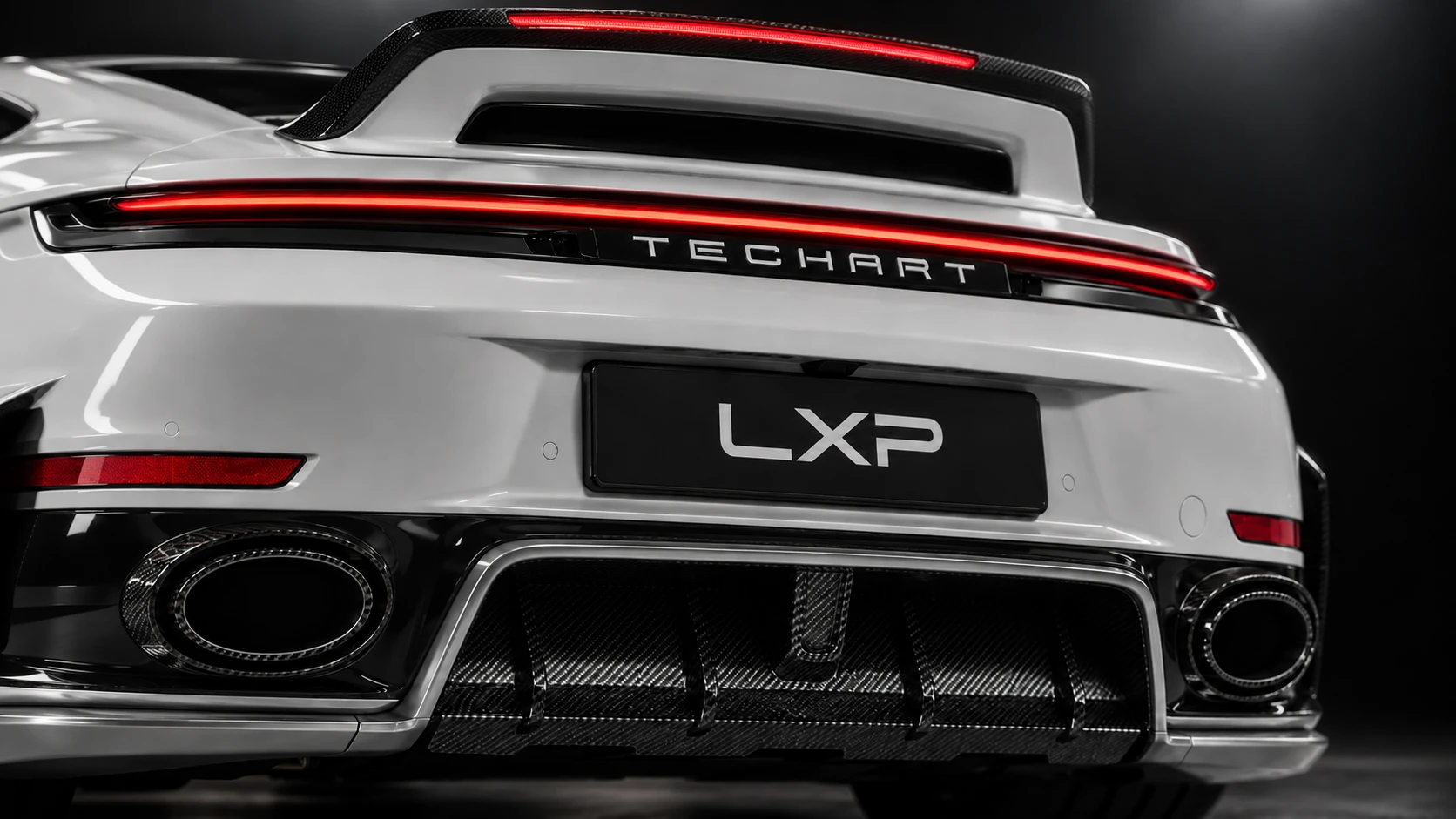 Pearl-white Porsche 911 Turbo S 992.2 with TECHART carbon aero and black Formula IX wheels: Exhaust & diffuser