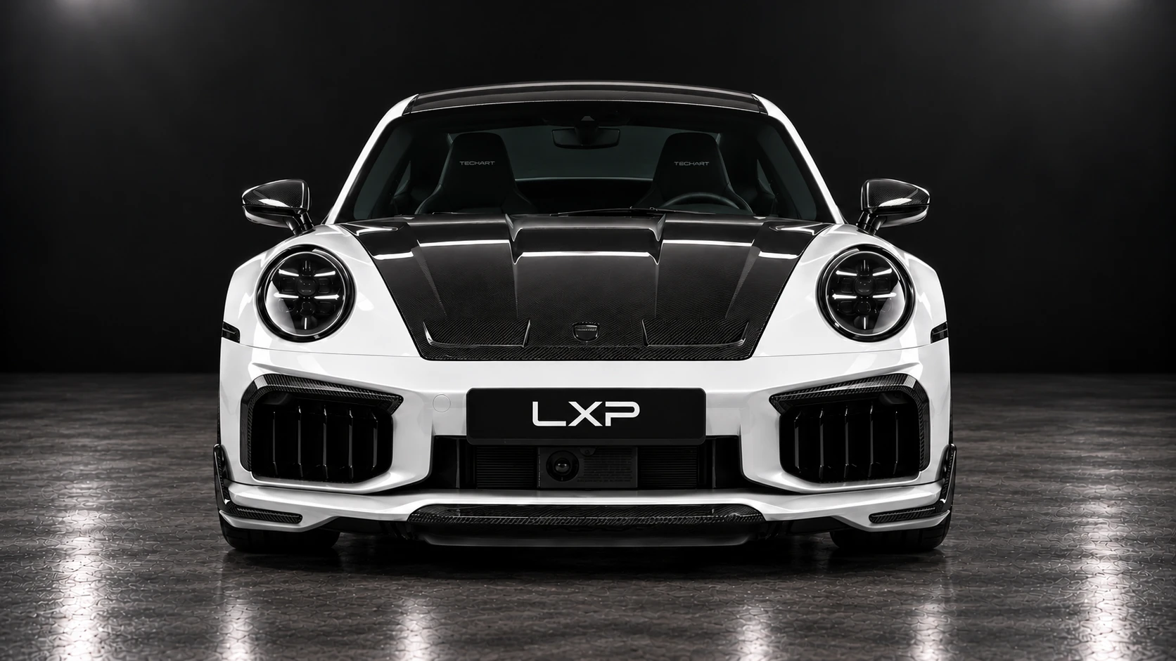 Pearl-white Porsche 911 Turbo S 992.2 with TECHART carbon aero and black Formula IX wheels: Straight front